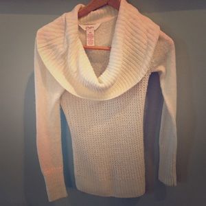 White cowl neck sweater.
